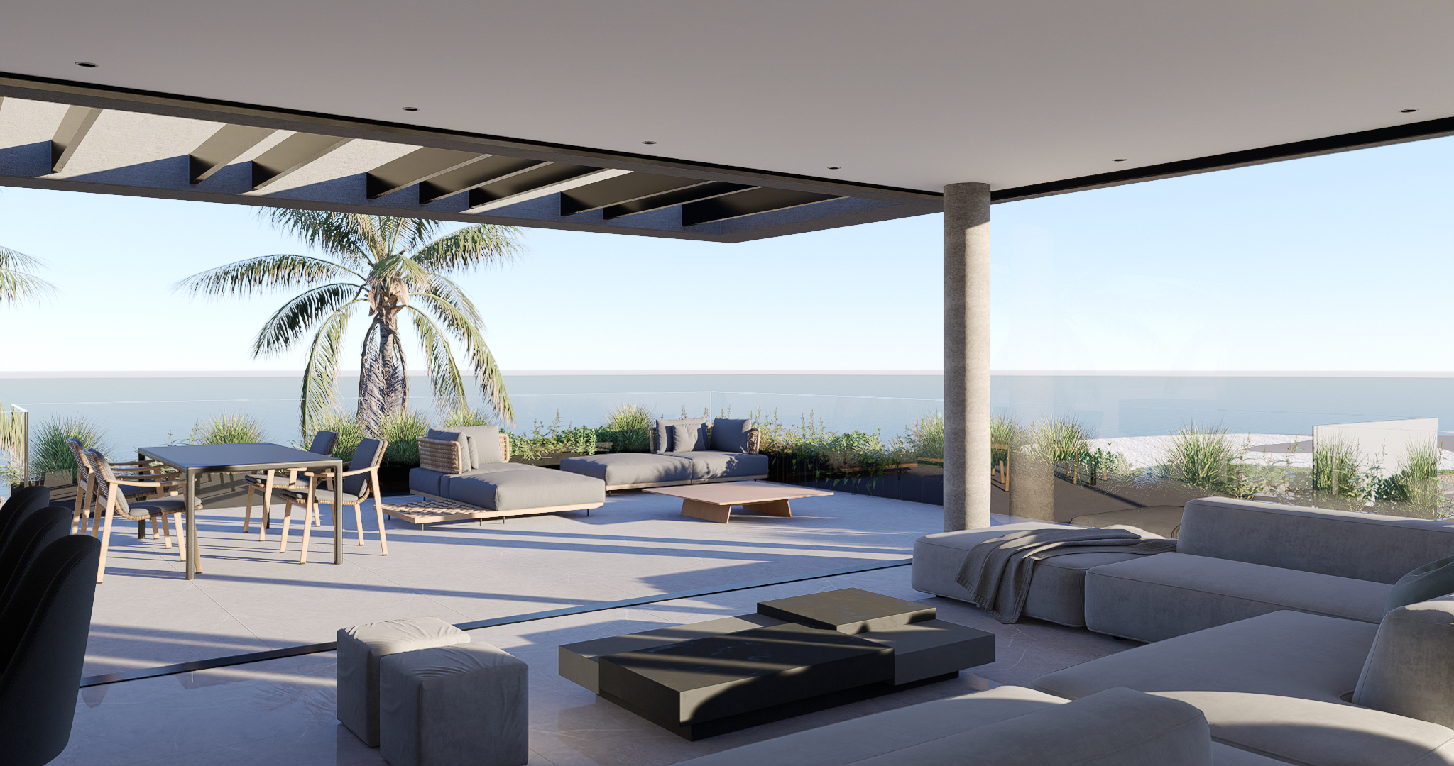 Terraza con vista al mar y mobiliario exterior, mostrando la integración con el paisaje