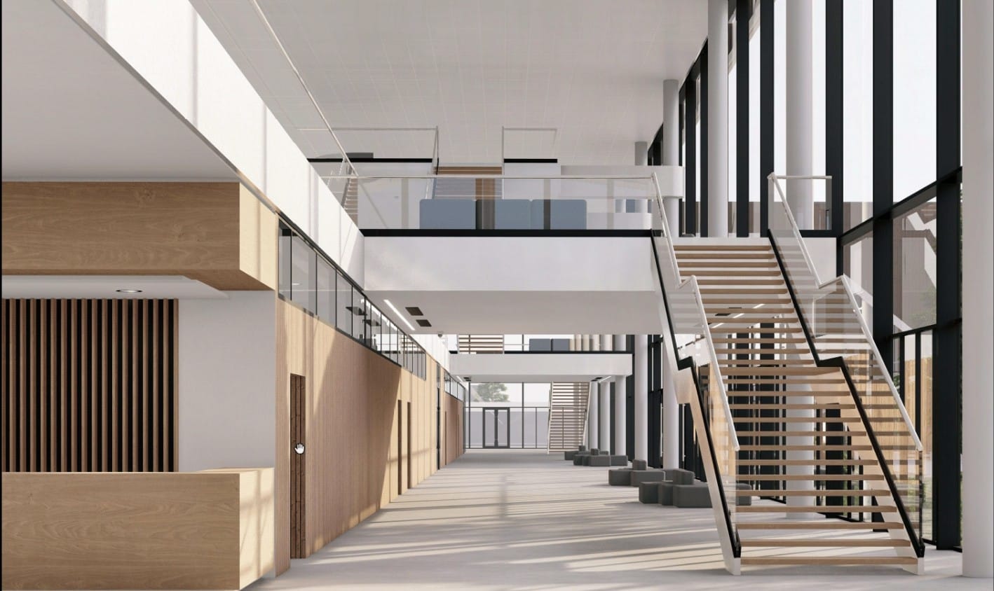 Vista del corredor interior con acabados en madera y escaleras de acceso a niveles superiores