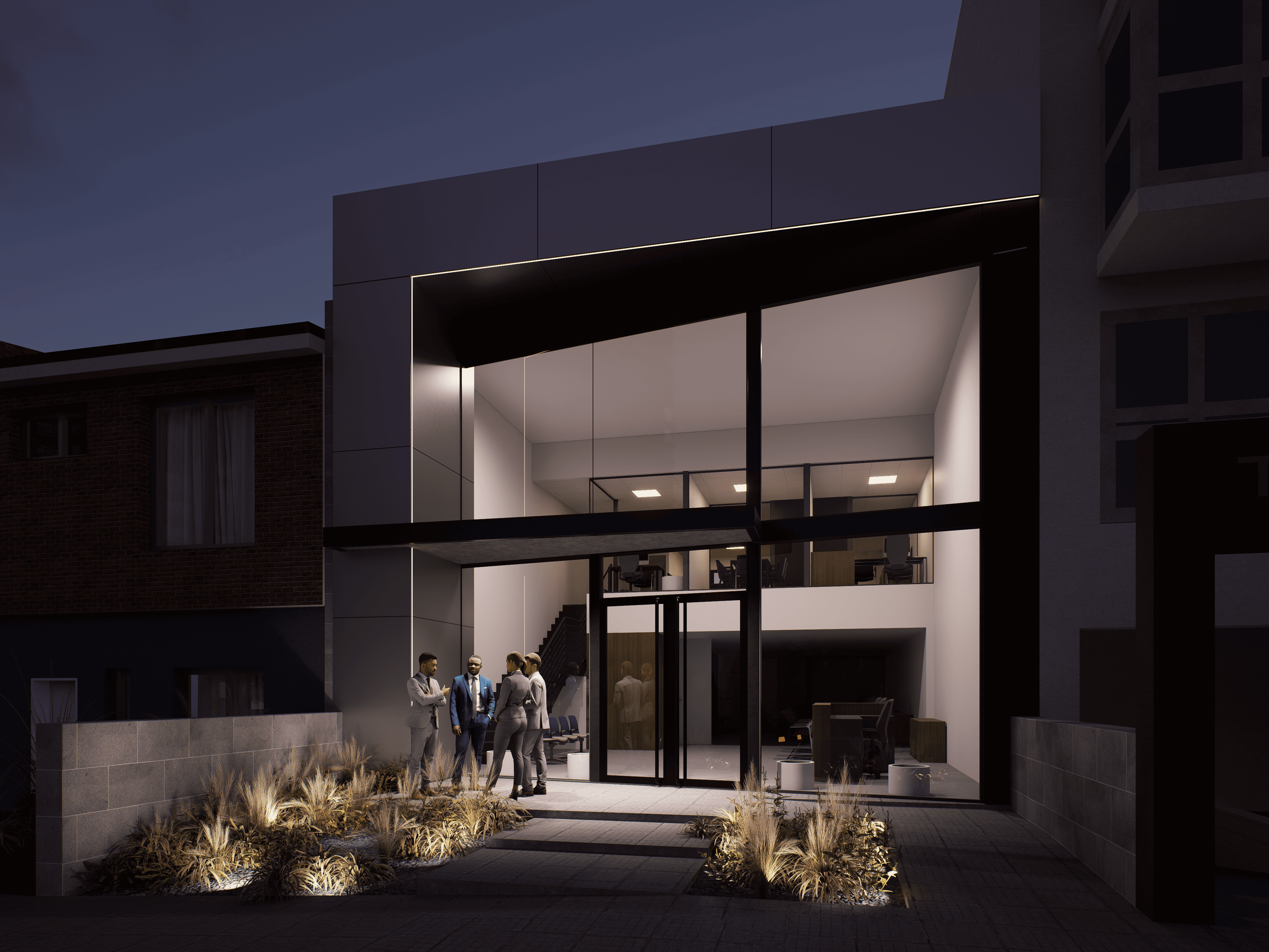 Vista nocturna del local comercial con iluminación arquitectónica resaltando los marcos de ventanas y paisajismo iluminado