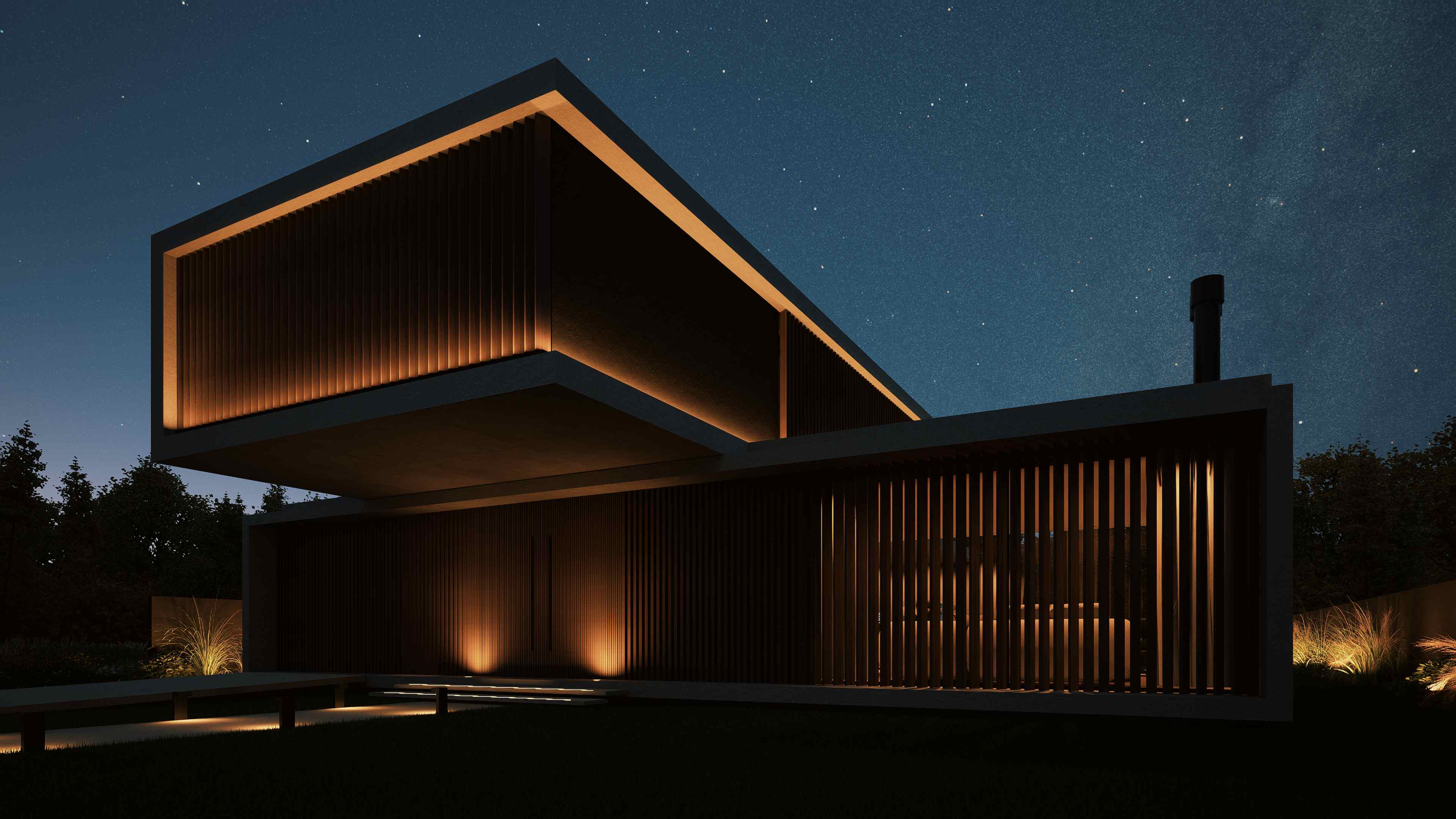 Vista en esquina nocturna con iluminación arquitectónica resaltando los detalles