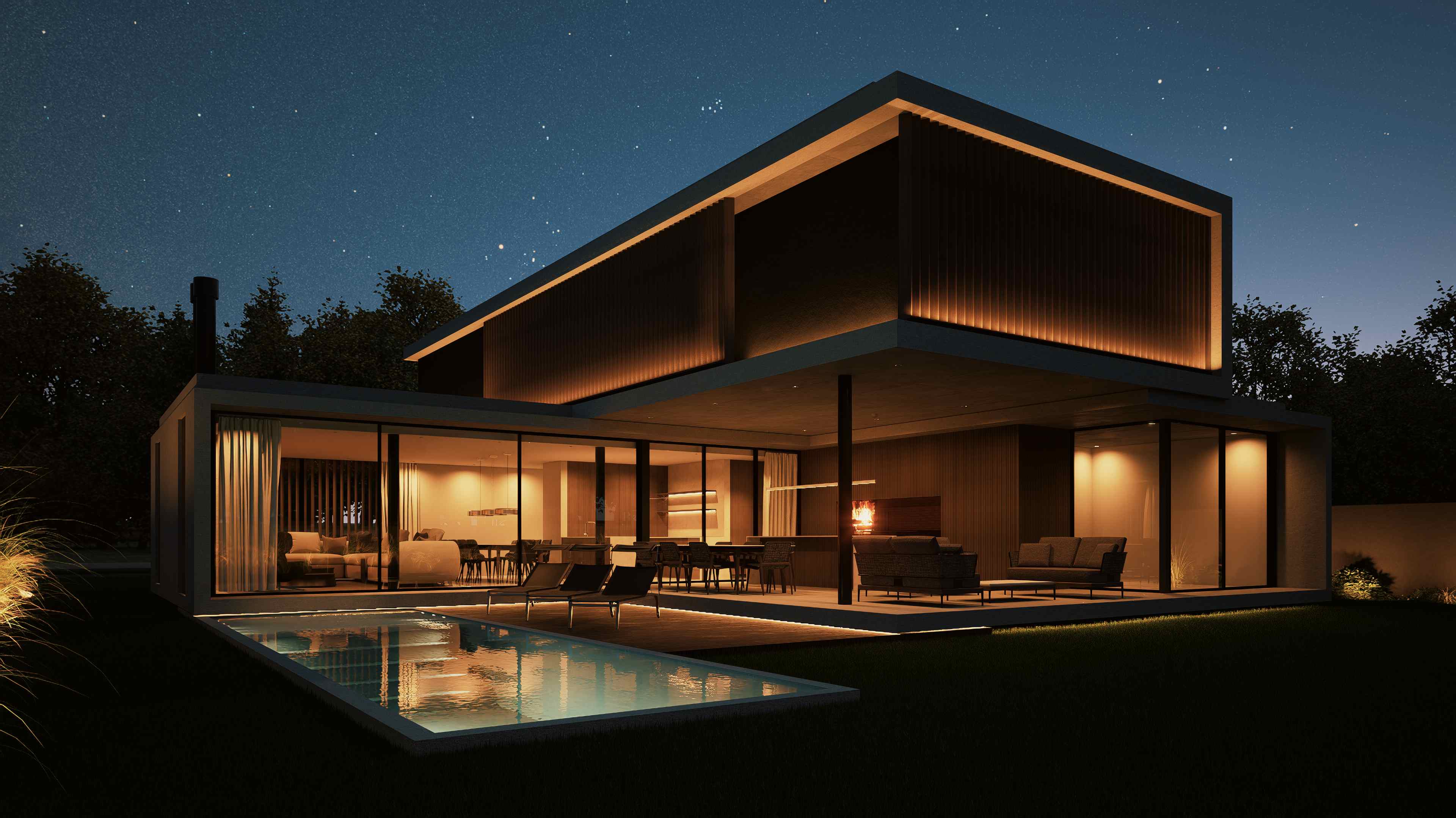 Vista nocturna desde la piscina con iluminación interior cálida